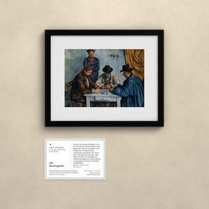 May include: A framed print of Paul C&eacute;zanne's painting The Card Players, depicting four figures at a table, accompanied by an informational card with the text Paul C&eacute;zanne, Die Kartenspieler, and details about the artwork's history and provenance.