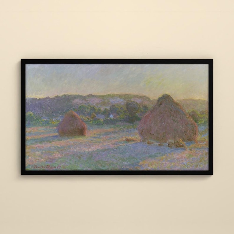 May include: A framed landscape painting featuring two large haystacks in a field under a soft, hazy sky. The scene uses a palette of muted purples, blues, and golden yellows to depict the rolling hills and grassy terrain in a textured style.