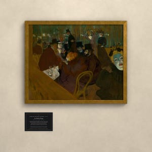 May include: A framed print of the painting At the Moulin Rouge by Henri de Toulouse-Lautrec, featuring a group of people in a dimly lit interior, with a small black informational plaque mounted below the artwork on the wall.