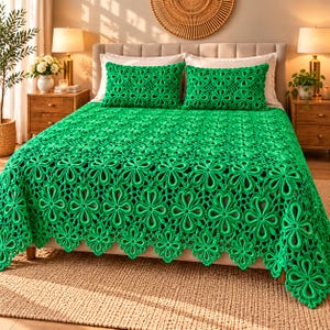 May include: A vibrant green crochet bedspread and two matching rectangular pillow shams, each featuring an intricate, repeating floral motif pattern. The textile is crafted with a detailed openwork design, creating a textured, lace-like appearance that covers the entire surface of the bedding set.