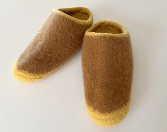 May include: A pair of brown wool slippers with yellow trim. The slippers are soft and cozy, perfect for keeping your feet warm in the winter.