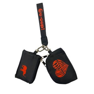 May include: Black dog waste bag dispenser with two zippered pouches and a wrist strap. The strap reads "Go-oop!" in red. One pouch has a red elephant graphic, the other a red heart design.