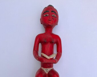 Vintage Baule seated woman statue from Ivory Coast, Africa.