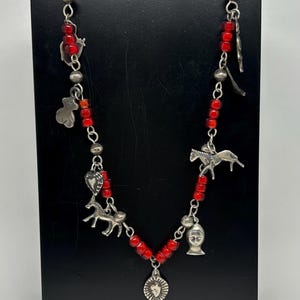 White heart necklace with Mexican and vintage Guatemalan Milagros