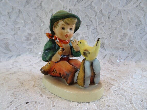 hummel boy with bird on foot
