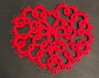 Red tatted heart doily