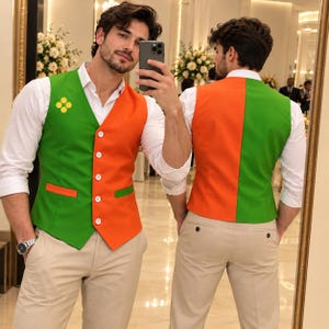 May include: A sleeveless waistcoat featuring a colour-blocked design with vibrant green and orange panels, a white button-down front closure, and a small yellow four-dot emblem on the chest, worn over a crisp white long-sleeved shirt and beige trousers.