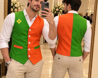 May include: A sleeveless vest featuring a color-blocked design with vibrant green and orange panels, a white button-down front closure, and a small yellow four-dot emblem on the chest, worn over a crisp white long-sleeved shirt and beige trousers.