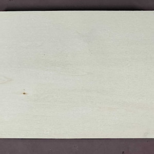 May include: A white wooden sign with a scalloped edge. The sign is blank and ready to be painted or decorated.