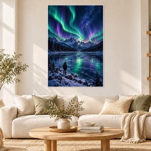 May include: A rectangular wall art print featuring a vibrant night landscape with green and purple aurora borealis lights above snow-covered mountains and a frozen lake, with a lone figure standing on the snowy shoreline in the foreground.