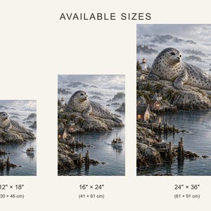 May include: Three vertical wall art prints labeled AVAILABLE SIZES, each depicting a spotted seal resting on a rocky coastal cliff above a harbor with a lighthouse and boat. Sizes shown are 12" x 18", 16" x 24", and 24" x 36".