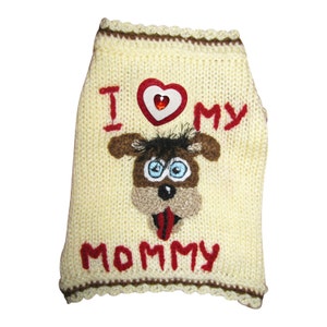 May include: A cream-colored knitted dog sweater with a red heart and the words "I love my mommy" embroidered on it.