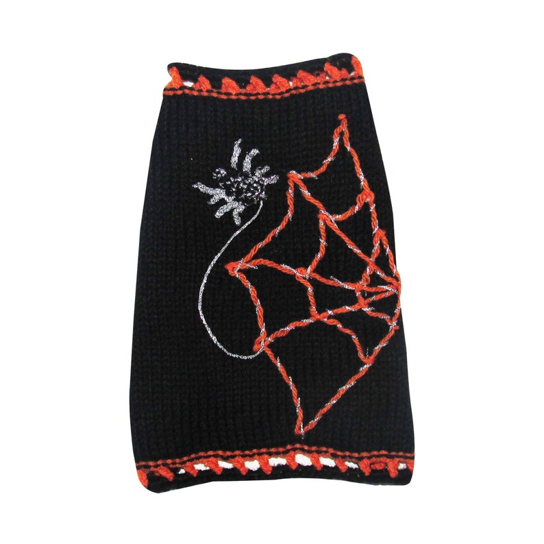 May include: Black knitted dog sweater with an orange and white crocheted trim. The sweater features a white spider web design with an orange spider.