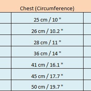 May include: Size chart for clothing with measurements in inches and centimeters. The chart shows sizes from XXXS to XL with corresponding length, chest, and neck measurements.
