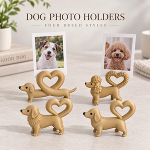 May include: Four gold-colored dog-shaped photo holders, each featuring a heart-shaped wire loop for displaying pictures. The text DOG PHOTO HOLDERS FOUR BREED STYLES is visible above the figures, which include a dachshund and a poodle.