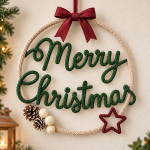 May include: A circular wall hanging featuring the text Merry Christmas in dark green knitted yarn. The hoop is wrapped in beige yarn, topped with a red fabric bow, and decorated with two brown pinecones, three white felt balls, and a red star.
