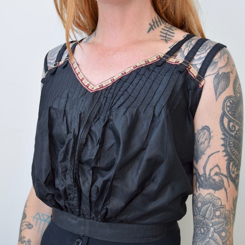 PINTUCK BLOUSE WITH DRAPED SLEEVE ADORNED IN ALEXANDRIA