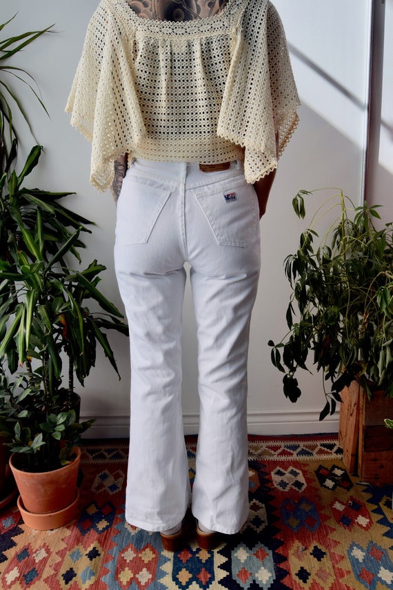 White flare bottom best sale jeans