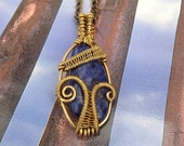 Wire wrapped sodalite brass pendant