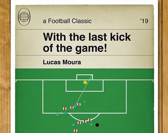 May include: A green and white football field with a black and white soccer ball in the goal. The text 'With the last kick of the game!' and 'Lucas Moura' is printed above the field. The text 'a Football Classic '19' is printed in the top right corner.