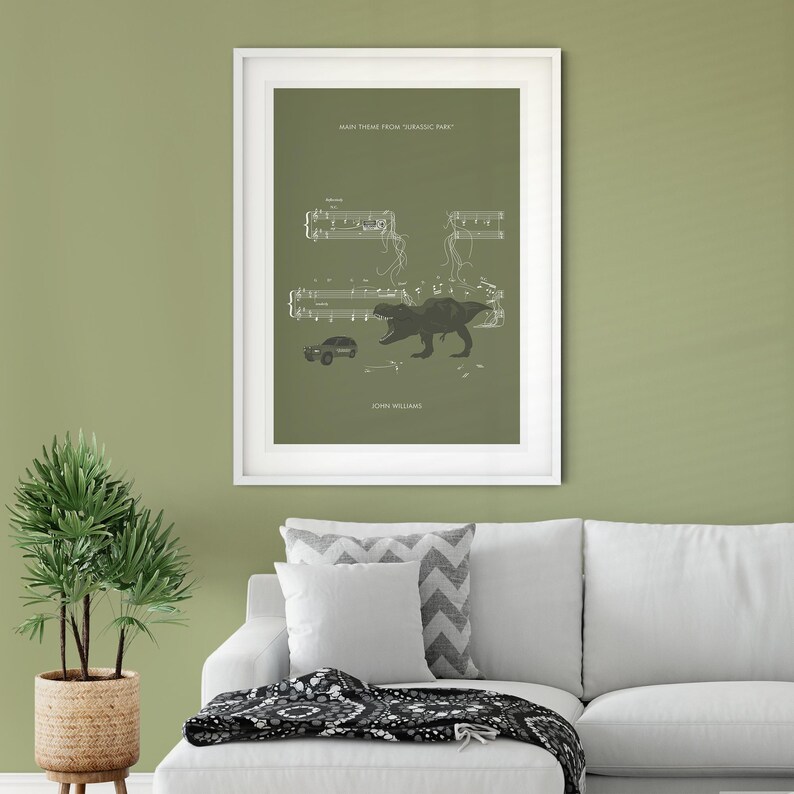 May include: A green poster with the text "Main Theme from Jurassic Park" and sheet music with a silhouette of a Tyrannosaurus Rex and a car. The text "John Williams" is at the bottom of the poster.