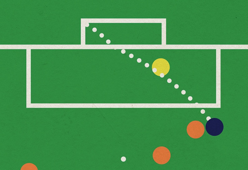 May include: A green field with a white football goal and a yellow ball flying through the air. There are orange and blue balls on the ground.