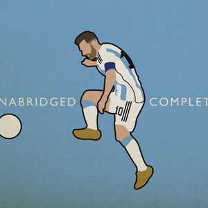 May include: A blue and white soccer jersey with the number 10 on the front. The jersey is worn by a player in a kicking motion, with the text "UNABRIDGED" and "COMPLETA" on either side of the image.