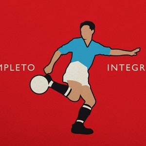 May include: Illustration of a soccer player kicking a ball, set against a red background. The player is depicted in a light blue jersey, white shorts, and black socks. The words "COMPLETO" and "INTEGRALE" are on either side.