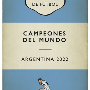 May include: A book cover with a blue and white color scheme. The title is "Campeones del Mundo" with the text "Argentina 2022" below. The cover features a soccer player in a blue and white jersey kicking a soccer ball. The text "Unabridged" and "Completa" is at the bottom of the cover.
