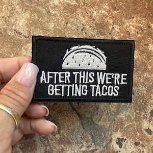 May include: Black embroidered patch with a white taco and the text "After this we're getting tacos".