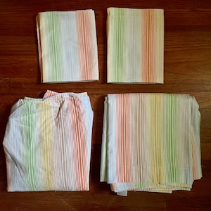 vintage full size bedsheet set pale radiating stripes rainbow ish pattern pale green yellow orange brown 4 piece set 80s stretched elastic