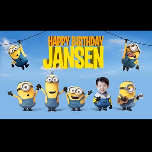 May include: A birthday card featuring a group of yellow Minions characters with blue overalls. The card has the text "Happy Birthday Jansen" in yellow letters.
