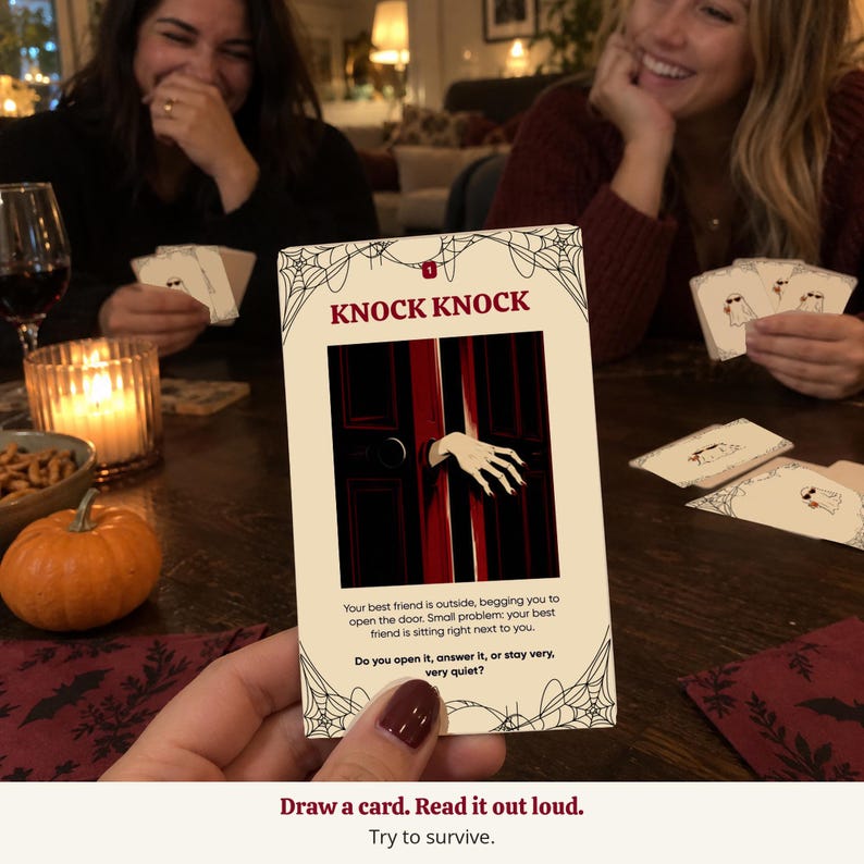 May include: A rectangular game card with a cream background and black spiderweb corners. The text reads KNOCK KNOCK, followed by an illustration of a hand reaching through a dark red door. Below is text about a friend outside and a question.
