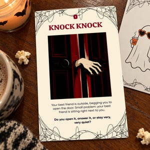 May include: A rectangular game card with a cream background and black spiderweb corners. The card features the text KNOCK KNOCK, an illustration of a pale hand reaching through a dark red door, and the prompt: Your best friend is outside, begging you to open the door. Small problem: your best friend is sitting right next to you. Do you open it, answer it, or stay very, very quiet?