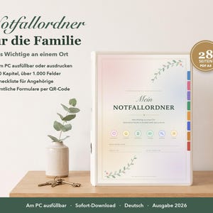 Puede incluir: Una carpeta blanca titulada Mein Notfallordner con una cubierta de degradado pastel, detalles florales y pesta&ntilde;as de colores. El texto incluye Notfallordner f&uuml;r die Familie, 28 Seiten PDF A4 y 2026 Ausgabe. Un jarr&oacute;n peque&ntilde;o con una planta y llaves al lado.