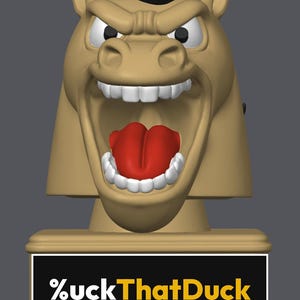 May include: A tan-colored horse head figurine with a black mane, white teeth, and a red tongue, featuring an aggressive expression. The base is a rectangular tan block with a black plaque displaying the white and yellow text %uckThatDuck.