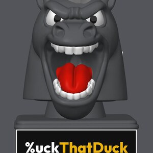 May include: A gray horse head figurine with a white mane, wide-open mouth, visible white teeth, and a bright red tongue. The base features a black rectangular plaque with the white and yellow text %uckThatDuck printed on the front surface.