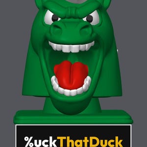 May include: A green horse head figurine with a white mane, white teeth, and a red tongue, mounted on a rectangular green base. The base features a black plaque with the white and yellow text %uckThatDuck printed on the front surface.