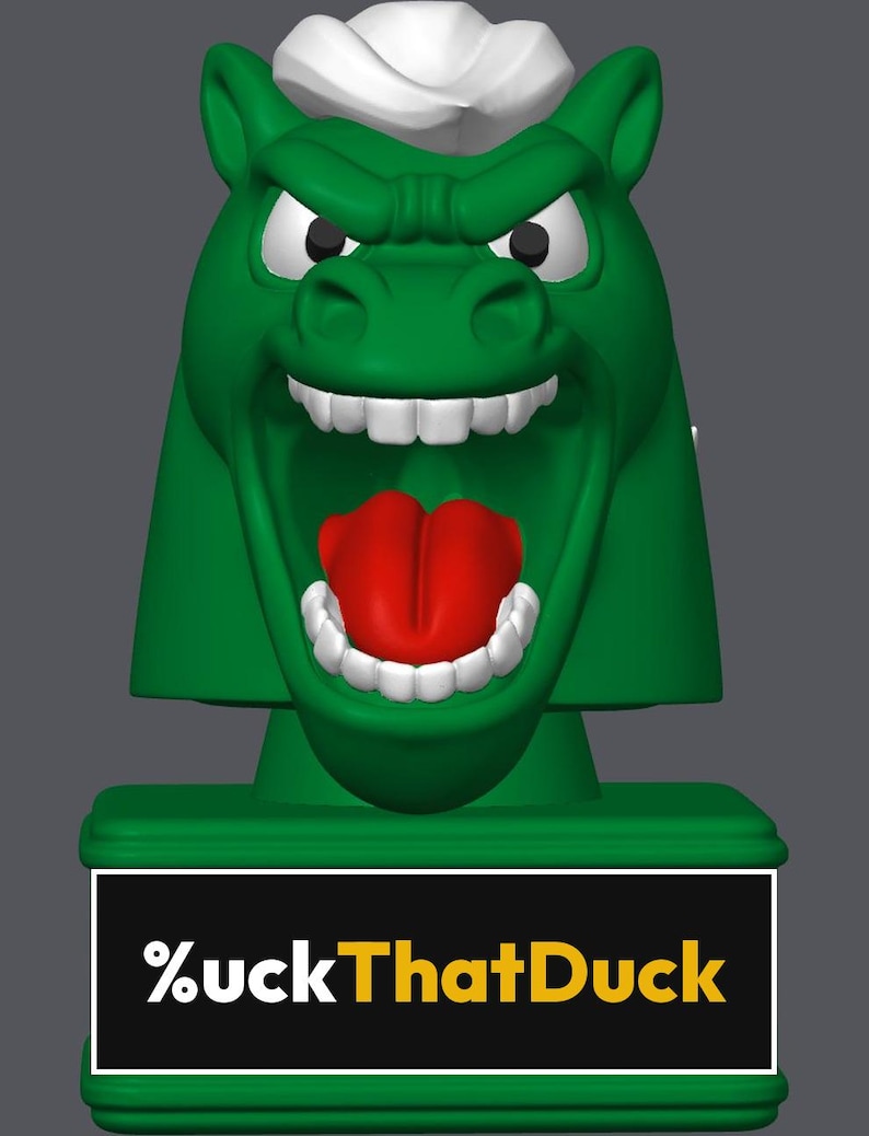 May include: A green horse head figurine with a white mane, white teeth, and a red tongue, mounted on a rectangular green base. The base features a black plaque with the white and yellow text %uckThatDuck printed on the front surface.