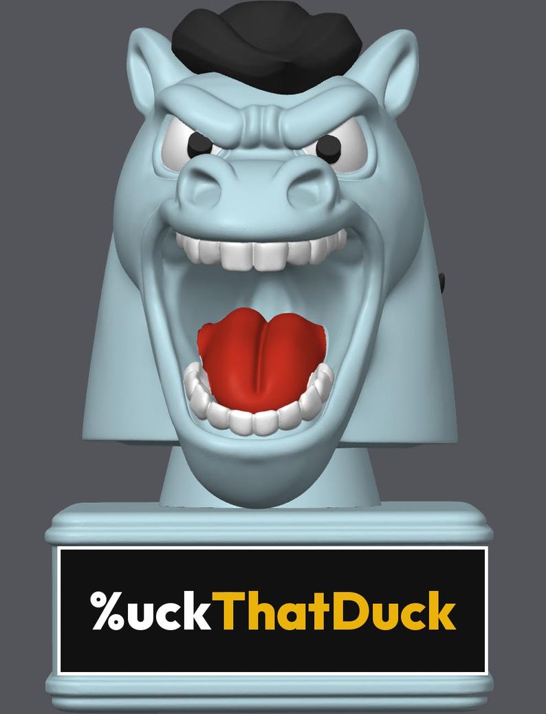 May include: A light blue horse head figurine with a black mane, white teeth, and a bright red tongue. The horse has an aggressive, open-mouthed expression. Below the head is a rectangular base with the text %uckThatDuck in white and yellow.