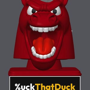 May include: A red figurine of a horse head with a white mane, wide open mouth, visible teeth, and a red tongue. The base is a rectangular red block featuring a black plaque with the white and yellow text %uckThatDuck printed on the front.