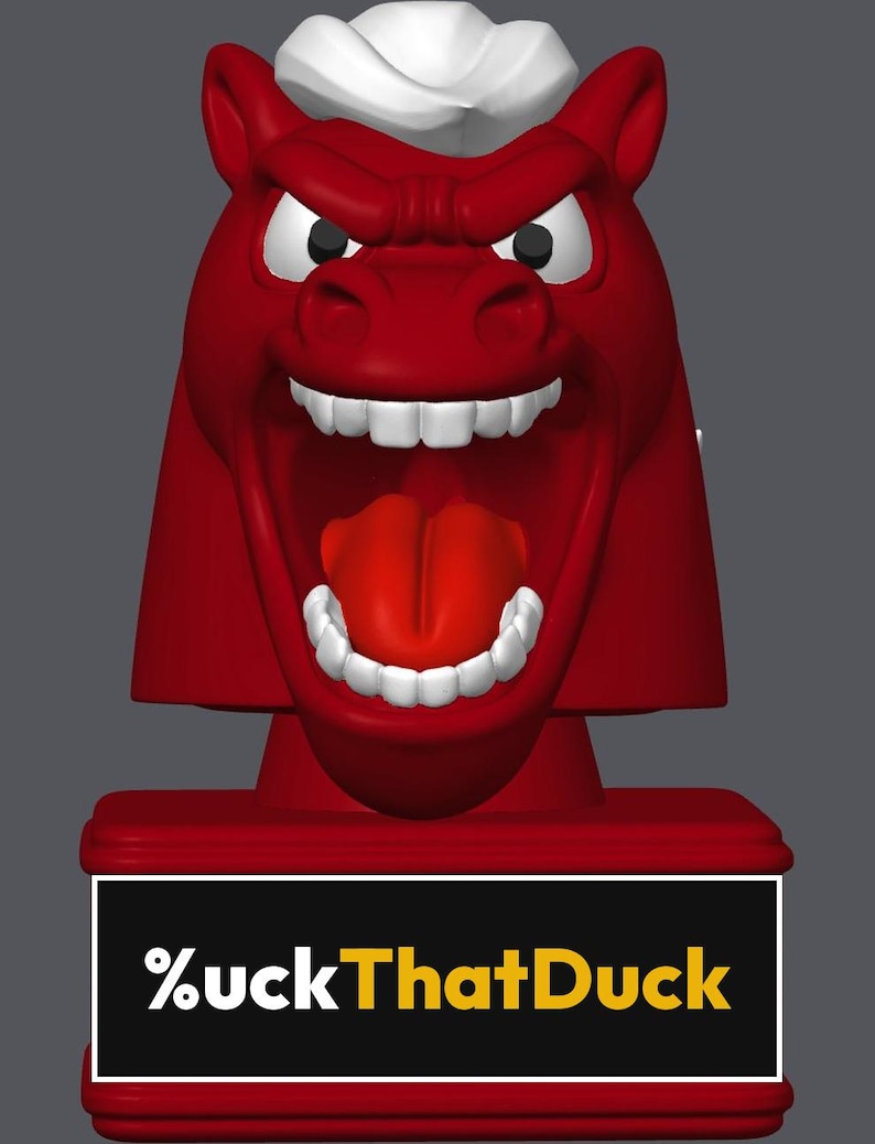May include: A red figurine of a horse head with a white mane, wide open mouth, visible teeth, and a red tongue. The base is a rectangular red block featuring a black plaque with the white and yellow text %uckThatDuck printed on the front.