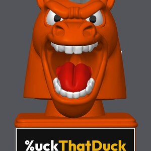 May include: An orange horse head figurine with a white mane, wide-open mouth, red tongue, and white teeth. The base is a rectangular orange block featuring a black plaque with the white and yellow text %uckThatDuck printed on the front.