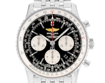 May include: A silver-tone Breitling Navitimer chronograph watch with a black dial, three white sub-dials, and a stainless steel link bracelet. The watch face features a slide rule bezel, a date window, and a gold-tone winged logo at the top.