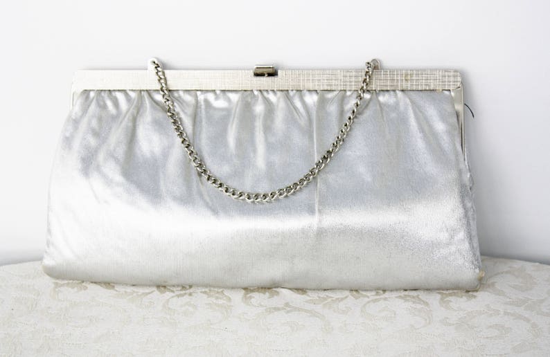 shiny silver clutch bag