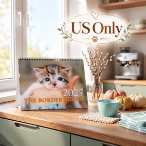 May include: A 2027 desk calendar titled THE BORDER BUNCH featuring a photograph of a kitten. The calendar is spiral-bound and displays the year 2027 in white text. Above the calendar, an oval graphic contains the text US Only.