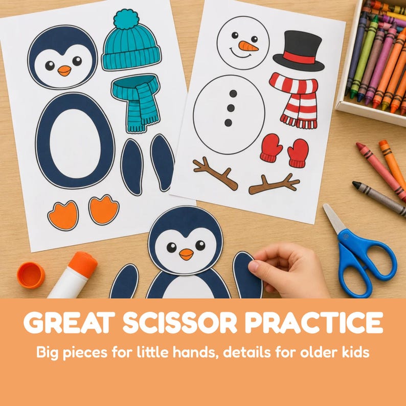 May include: Two printed activity sheets featuring cut-out shapes for a penguin and a snowman, including hats, scarves, and mittens. A partially assembled penguin, a glue stick, blue scissors, and a box of crayons are arranged on a table.