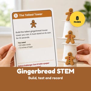 May include: A white activity card titled 1 The Tallest Tower with instructions to build a gingerbread house tower using 20 index cards and 12 inches of tape, next to a vertical stack of three white paper cups and three gingerbread men.