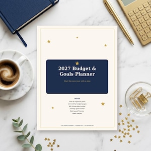 May include: A 2027 Budget & Goals Planner with a cream cover, a dark blue rectangular center, and gold star accents. The text reads 2027 Budget & Goals Planner, Start the new year with a plan, and lists features like monthly budget pages.