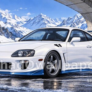 May include: A white sports car with blue accents on the front splitter and rear spoiler, parked on a wet surface. The vehicle features dark grey wheels and a sleek aerodynamic body design. Snow-covered mountains are visible in the background.